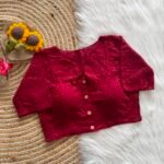 A beautifully crafted Hakoba cotton blouse featuring delicate embroidered eyelet detailing and a refined front-button design.