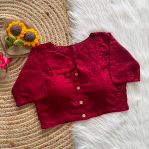 A beautifully crafted Hakoba cotton blouse featuring delicate embroidered eyelet detailing and a refined front-button design.